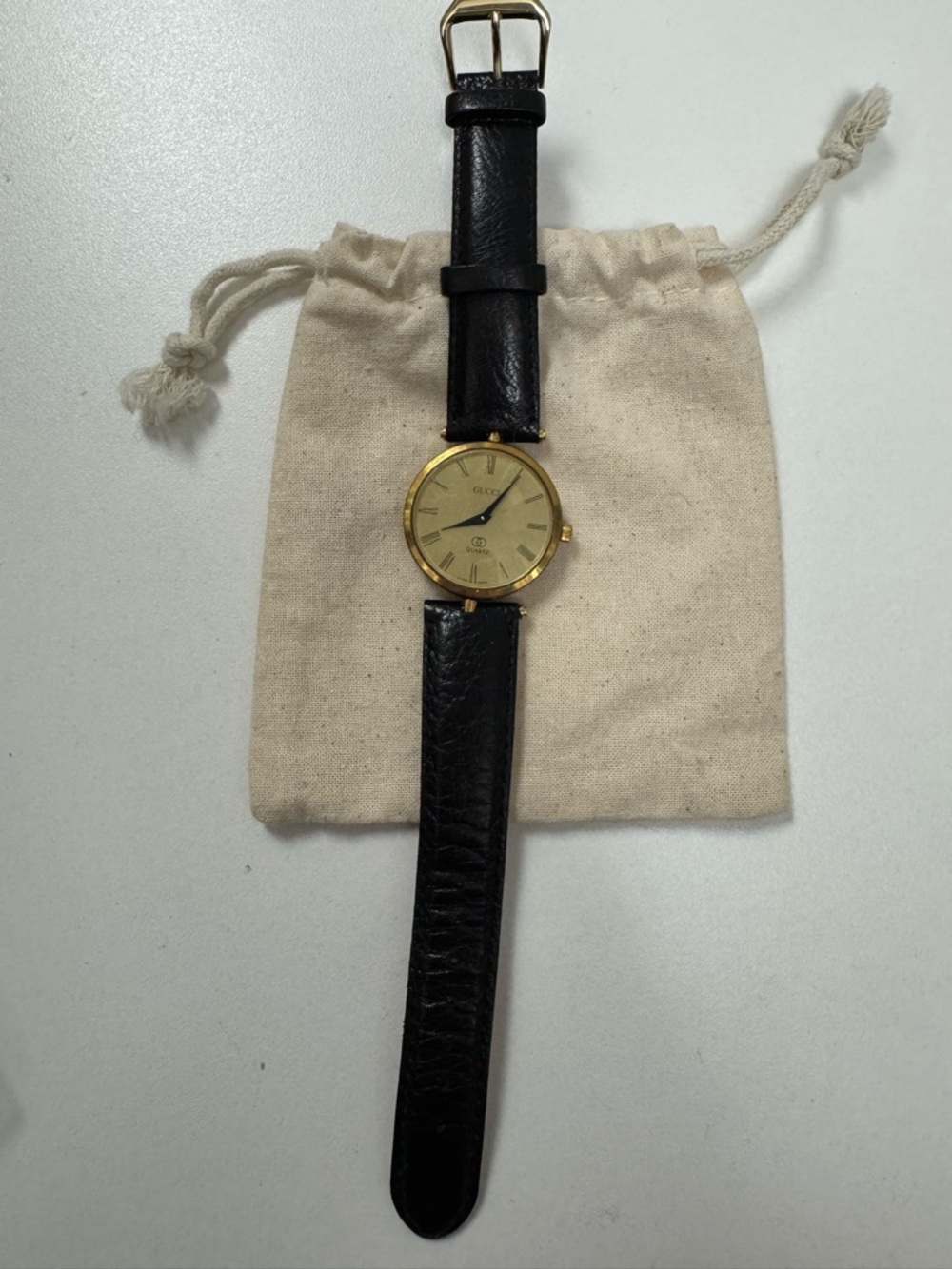 Gucci Gold Dial Watch with Black Leather Strap